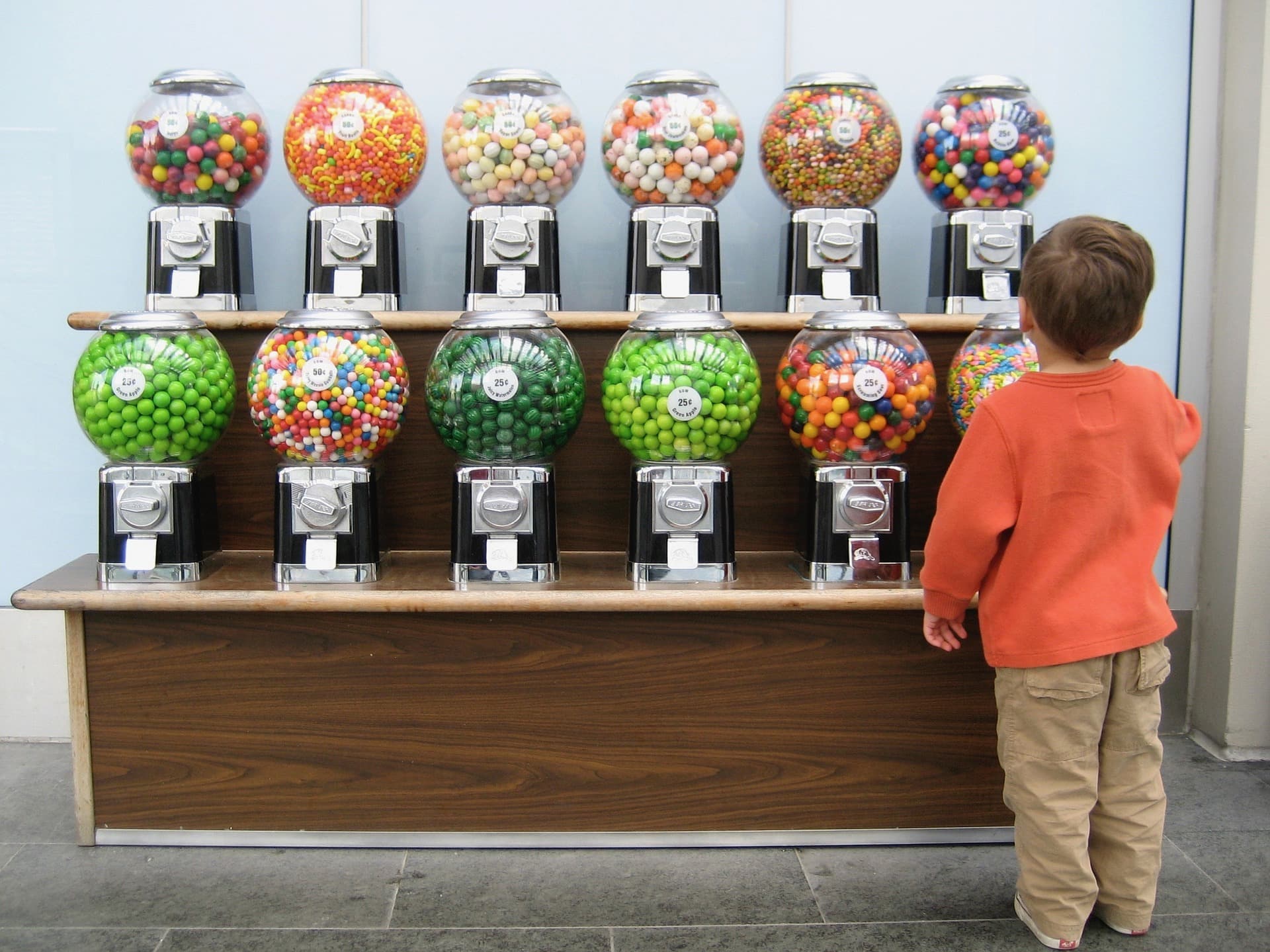 Kid looking at gumball flavours